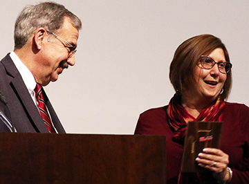 Rhonda McLaughlin receives her award from President Bitterbaum